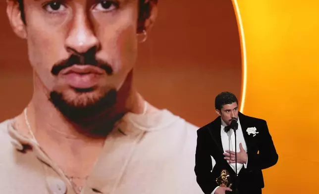 Bad Bunny accepts the award for best música urbana album for "Debí Tirar Más Fotos" during the 68th annual Grammy Awards on Sunday, Feb. 1, 2026, in Los Angeles. (AP Photo/Chris Pizzello)