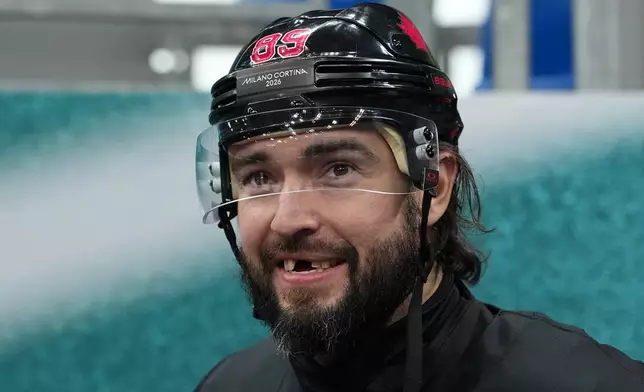 Canada's Drew Doughty arrives for men's ice hockey practice at the 2026 Winter Olympics, in Milan, Italy, Sunday, Feb. 8, 2026. (AP Photo/Carolyn Kaster)