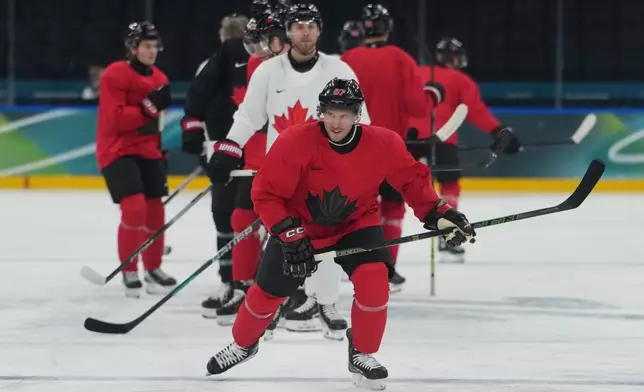 Canada's Sidney Crosby skates up the ice during men's ice hockey practice at the 2026 Winter Olympics, in Milan, Italy, Sunday, Feb. 8, 2026. (AP Photo/Carolyn Kaster)