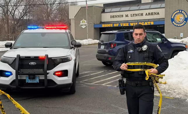 Police continue to tape off the Dennis M. Lynch arena a day after a deadly shooting during a youth hockey game on Tuesday, Feb. 17, 2026 in Pawtucket, R.I. (AP Photo/Rodrique Ngowi)