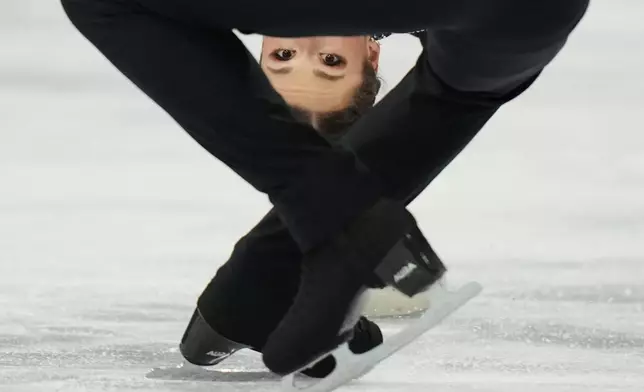 Annika Hocke and Robert Kunkel of Germany compete during the pairs figure skating long program at the 2026 Winter Olympics, in Milan, Italy, Monday, Feb. 16, 2026. (AP Photo/Francisco Seco)