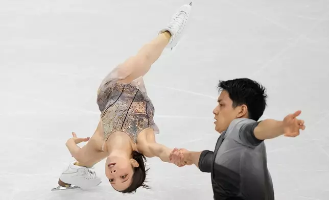 Riku Miura and Ryuichi Kihara of Japan compete during the pairs figure skating long program at the 2026 Winter Olympics, in Milan, Italy, Monday, Feb. 16, 2026. (AP Photo/Natacha Pisarenko)