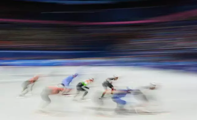 Team China, Team Italy, Team Canada and Team Hungary compete in the men's 5000m relay short track speed skating at the 2026 Winter Olympics, in Milan, Italy, Monday, Feb. 16, 2026. (AP Photo/Francisco Seco)