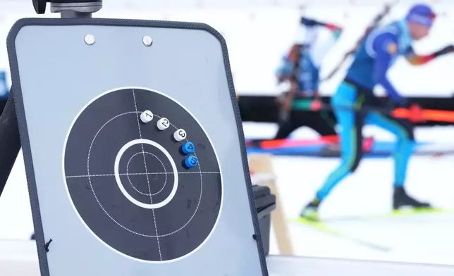 Athletes participate in a biathlon training session at the 2026 Winter Olympics in Anterselva, Italy, Monday, Feb. 16, 2026. (AP Photo/Andrew Medichini)