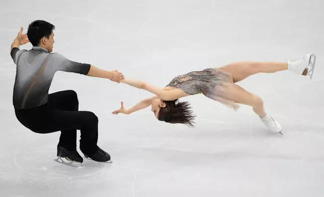 Riku Miura and Ryuichi Kihara of Japan compete during the pairs figure skating long program at the 2026 Winter Olympics, in Milan, Italy, Monday, Feb. 16, 2026. (AP Photo/Natacha Pisarenko)