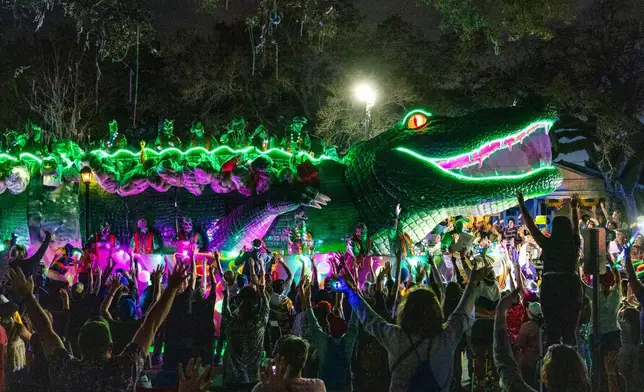 Attendees march during the annual Krewe of Bacchus parade during the Mardi Gras season on Sunday, Feb. 15, 2026, in New Orleans. (Photo by Amy Harris/Invision/AP)