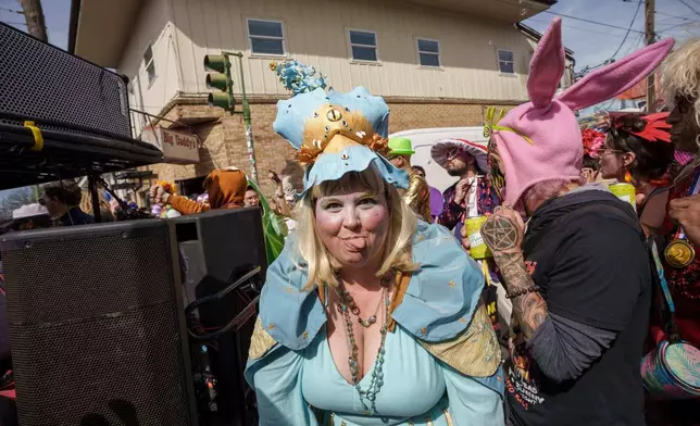 People participating in the Society of Saint Anne parade wander through the Bywater and Marigny neighborhoods on Mardi Gras Day, Tuesday, Feb. 17, 2026 in New Orleans. (AP Photo/Matthew Hinton)