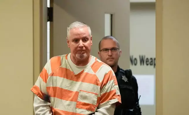 FILE - Colin Gray, the father of Apalachee High School shooting suspect Colt Gray, arrives to the courtroom at the Barrow County courthouse on Thursday, Dec. 18, 2025, in Winder,Ga. (AP Photo/Brynn Anderson, File)