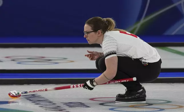 Switzerland's Alina Paetz in action during the women's curling round robin session against Sweden at the 2026 Winter Olympics, in Cortina d'Ampezzo, Italy, Monday, Feb. 16, 2026. (AP Photo/Fatima Shbair)