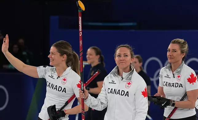 Canada's Rachel Homan, Sarah Wilkes and Emma Miskew react after the women's curling round robin session against China at the 2026 Winter Olympics, in Cortina d'Ampezzo, Italy, Monday, Feb. 16, 2026. (AP Photo/Fatima Shbair)