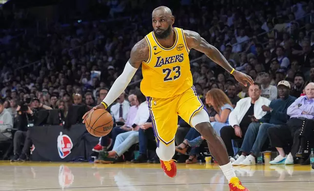 Los Angeles Lakers forward LeBron James drives to the basket during the second half of an NBA basketball game against the Golden State Warriors Saturday, Feb. 7, 2026, in Los Angeles. (AP Photo/Jae C. Hong)