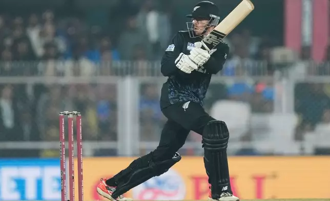 New Zealand's captain Mitchell Santner plays a shot during the third T20 cricket match between India and New Zealand in Guwahati, India, Sunday, Jan. 25, 2026. (AP Photo/Anupam Nath)
