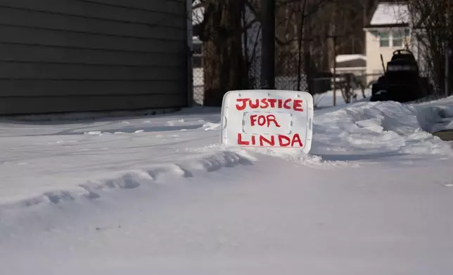 A sign reading "Justice for Linda" is seen in a yard near the home of William Stevenson, the ex-husband of former first lady Jill Biden, in Wilmington, Del., Tuesday, Feb. 3, 2026. (AP Photo/Mingson Lau)