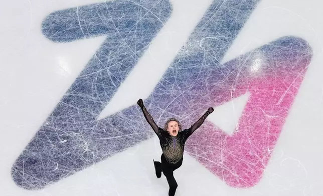 Ilia Malinin of the United States wobbles while competing during the figure skating men's team event at the 2026 Winter Olympics, in Milan, Italy, Sunday, Feb. 8, 2026. (AP Photo/Bernat Armangue)