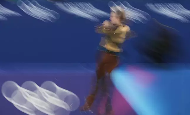 Ilia Malinin of the United States competes during the figure skating men's team event at the 2026 Winter Olympics, in Milan, Italy, Saturday, Feb. 7, 2026. (AP Photo/Francisco Seco)