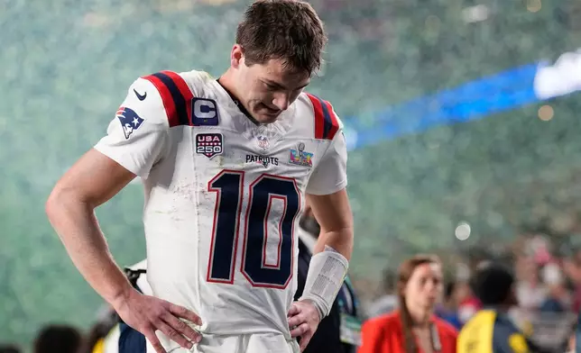 New England Patriots quarterback Drake Maye walks off the field after a loss to the Seattle Seahawks in the NFL Super Bowl 60 football game, Sunday, Feb. 8, 2026, in Santa Clara, Calif. (AP Photo/Julio Cortez)