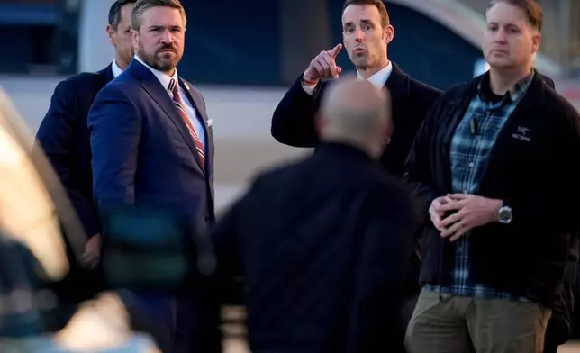 FBI Deputy Director Andrew Bailey, right, stands with members of the FBI at the Fulton County Elction HUB, Wednesday, Jan. 28, 2026, in Union City, Ga., near Atlanta. (AP Photo/Mike Stewart)