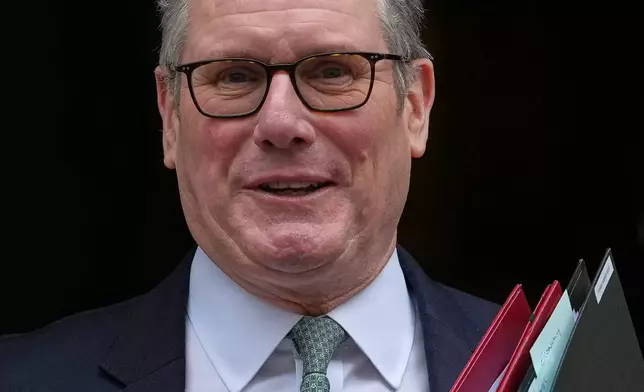 FILE - Britain's Prime Minister Keir Starmer leaves 10 Downing Street to attend the weekly Prime Ministers' Questions session in parliament in London, Wednesday, Feb. 11, 2026. (AP Photo/Alastair Grant, File)