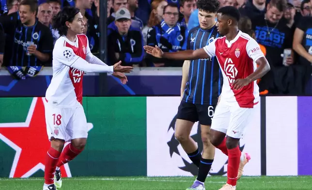 FILE - Monaco's Ansu Fati, right, is congratulated by Monaco's Takumi Minamino after scoring his sides first goal during the Champions League opening phase soccer match between Club Brugge and Monaco at the Jan Breydel Stadium in Bruges, Belgium, Thursday, Sept. 18, 2025. (AP Photo/Omar Havana, file)