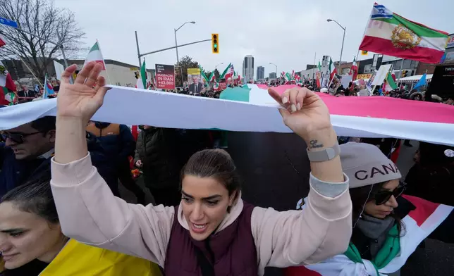 Supporters of Iran's exiled Crown Prince Reza Pahlavi attend a demonstration in Toronto, Saturday, Feb. 14, 2026. (AP Photo/Kamran Jebreili)