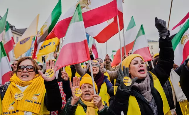 Supporters of the Iranian opposition organisation People's Mujahedeen Organisation of Iran, PMOI, also known as the Mujahedeen-e-Khalq, MEK, attend a protest during the Munich Security Conference in Munich, Germany, Friday, Feb. 13, 2026. (AP Photo/Ebrahim Noroozi)