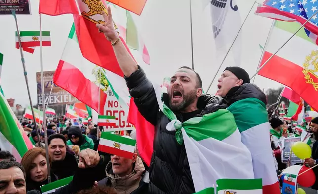 Supports of Iran's exiled Crown Prince Reza Pahlavi attend a demonstration during the Munich Security Conference in Munich, Germany, Saturday, Feb. 14, 2026. (AP Photo/Ebrahim Noroozi)