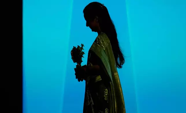 Indian teacher Rouble Nagi walks off the stage after receiving the Global Teacher Prize trophy from Dubai Crown Prince Sheikh Hamdan bin Mohammed Al Maktoum at a ceremony in Dubai, United Arab Emirates, Thursday, Feb. 5, 2026. (AP Photo/Altaf Qadri)