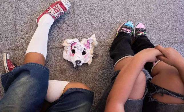 An animal mask sits on the floor during a gathering of therians, people who say they identify as non-human animals, in Buenos Aires, Argentina, Sunday, Feb. 22, 2026. (AP Photo/Rodrigo Abd)