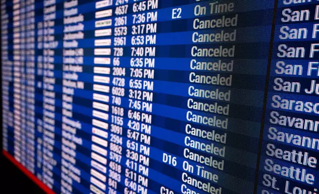 Rows of cancelled flights are displayed at the Philadelphia International Airport on Monday, Feb. 23, 2026 in Philadelphia. (AP Photo/Joe Lamberti)