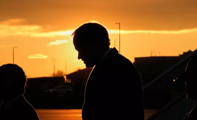 U.S. Secretary of State Marco Rubio, silhouetted against the setting sun, arrives at the Liszt Ferenc International Airport in Budapest, Hungary, Sunday, Feb. 15, 2026. (AP Photo/Alex Brandon, Pool)