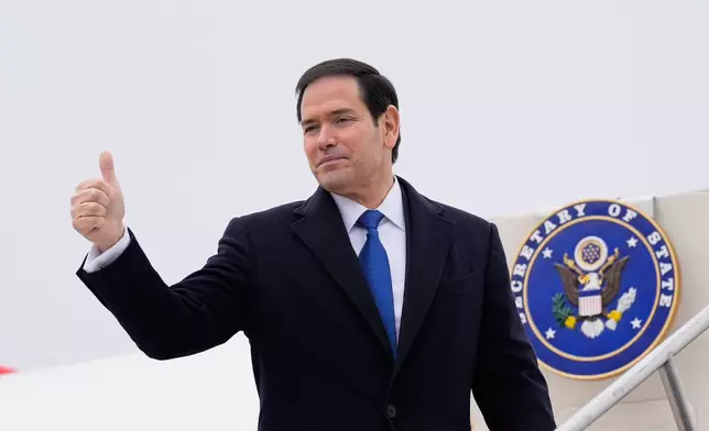 U.S. Secretary of State Marco Rubio gives a thumbs up as he departs at the Liszt Ferenc International Airport in Budapest, Hungary, Monday, Feb. 16, 2026. (AP Photo/Alex Brandon, Pool)