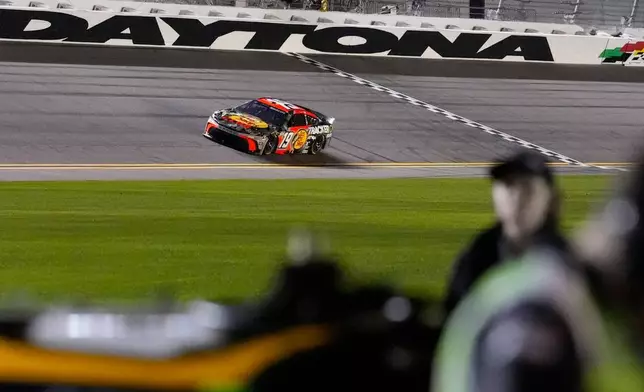 Chase Briscoe, (19) runs during NASCAR Daytona 500 qualifying, Wednesday, Feb. 11, 2026, in Daytona, Fla. (AP Photo/Mike Stewart)