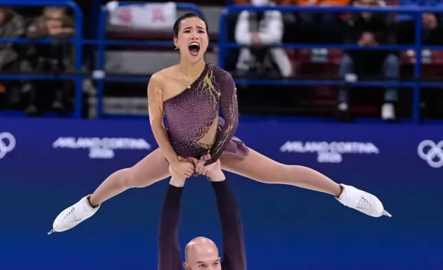 Ellie Kam and Danny O'Shea of the United States compete during the pairs figure skating short program at the 2026 Winter Olympics, in Milan, Italy, Sunday, Feb. 15, 2026. (AP Photo/Ashley Landis)