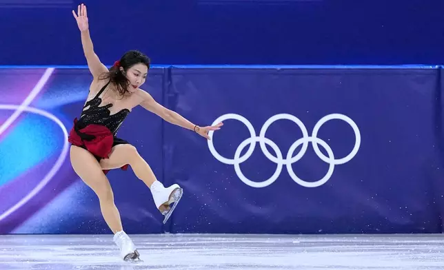 Sui Wenjing stumbles with her partner Han Cong of China compete during the pairs figure skating short program at the 2026 Winter Olympics, in Milan, Italy, Sunday, Feb. 15, 2026. (AP Photo/Natacha Pisarenko)