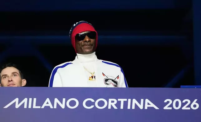 Snoop Dogg attends the women's short program figure skating at the 2026 Winter Olympics, in Milan, Italy, Tuesday, Feb. 17, 2026. (AP Photo/Natacha Pisarenko)