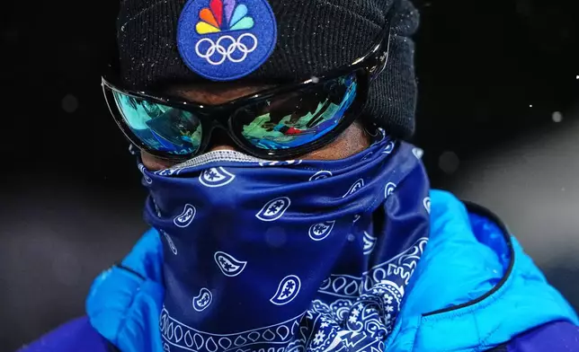 Snoop Dogg looks on during the women's snowboarding halfpipe finals at the 2026 Winter Olympics, in Livigno, Italy, Thursday, Feb. 12, 2026. (AP Photo/Lindsey Wasson)
