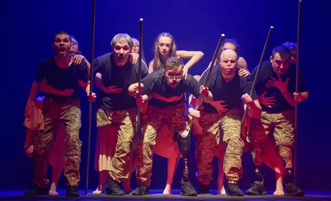 Ukrainian war veterans, many of whom sustained severe injuries in combat during Russia's full-scale invasion of Ukraine, perform during a premiere on Thursday, Feb. 19, 2026, in Kyiv, Ukraine. (AP Photo/Efrem Lukatsky)