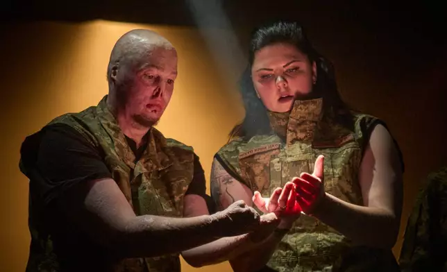 Ukrainian war veterans, many of whom sustained severe injuries in combat during Russia's full-scale invasion of Ukraine, perform during a premiere on Thursday, Feb. 19, 2026, in Kyiv, Ukraine. (AP Photo/Efrem Lukatsky)