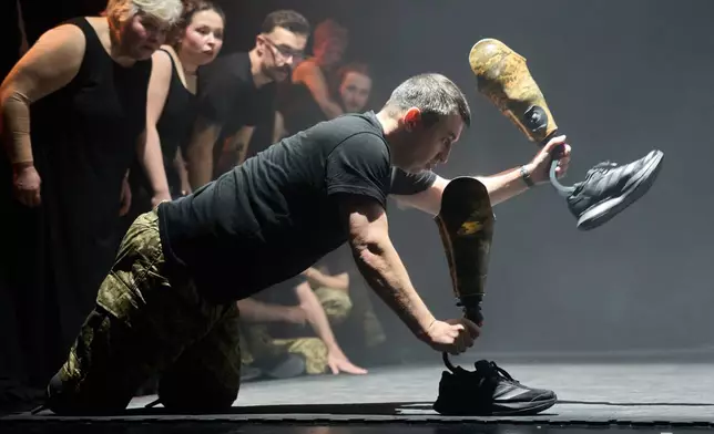 Artem Moroz, who sustained severe injuries in combat during Russia's full-scale invasion in Ukraine, performs during the play premiere in Kyiv, Ukraine, Thursday, Feb. 19, 2026. (AP Photo/Efrem Lukatsky)