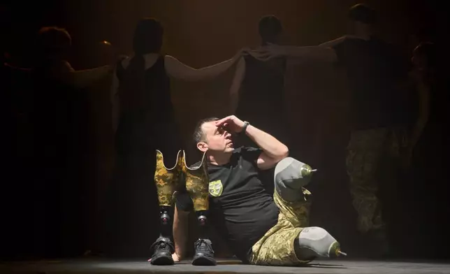 Artem Moroz, who sustained severe injuries in combat during Russia's full-scale invasion in Ukraine, performs during the play premiere in Kyiv, Ukraine, Thursday, Feb. 19, 2026. (AP Photo/Efrem Lukatsky)