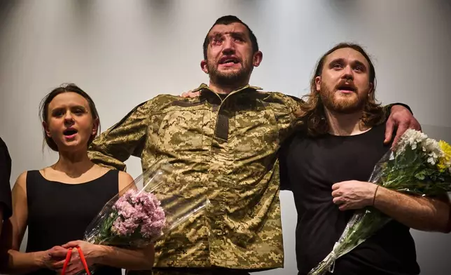Ukrainian war veterans, many of whom sustained severe injuries in combat during Russia's full-scale invasion of Ukraine, perform during a premiere on Thursday, Feb. 19, 2026, in Kyiv, Ukraine. (AP Photo/Efrem Lukatsky)