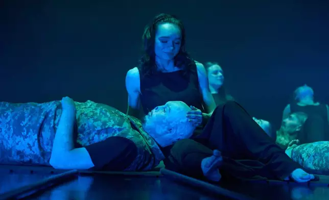 Ukrainian war veterans, many of whom sustained severe injuries in combat during Russia's full-scale invasion of Ukraine, perform during a premiere on Thursday, Feb. 19, 2026, in Kyiv, Ukraine. (AP Photo/Efrem Lukatsky)