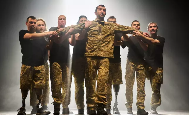 Ukrainian war veterans, many of whom sustained severe injuries in combat during Russia's full-scale invasion of Ukraine, perform during a premiere on Thursday, Feb. 19, 2026, in Kyiv, Ukraine. (AP Photo/Efrem Lukatsky)