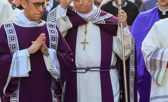 Pope Leo XIV arrives in a penitential procession marking the start of the Catholic Lent, at the Basilica of Santa Sabina in Rome, Wednesday, Feb. 18, 2026, where he will preside over Ash Wednesday Mass. (AP Photo/Riccardo De Luca)