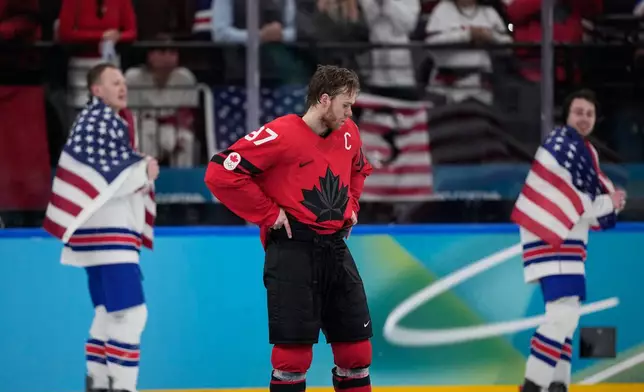 Canada's Connor McDavid (97) reacts after Canada lost to the United States in a men's ice hockey gold medal game between Canada and the United States at the 2026 Winter Olympics, in Milan, Italy, Sunday, Feb. 22, 2026. (AP Photo/Petr David Josek)