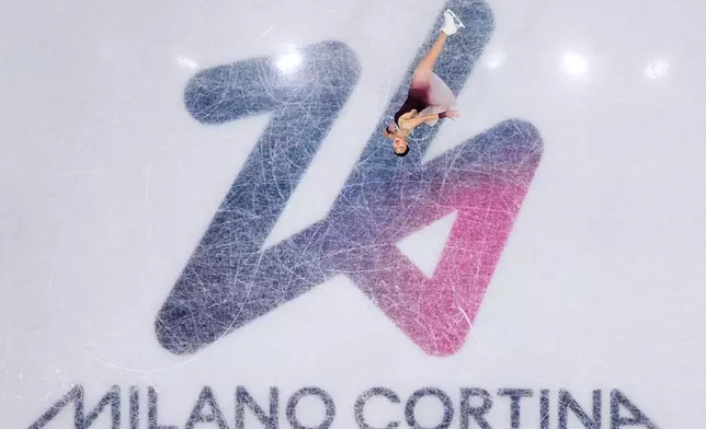 Kaori Sakamoto of Japan competes during the figure skating women's team event at the 2026 Winter Olympics, in Milan, Italy, Sunday, Feb. 8, 2026. (AP Photo/Bernat Armangue)