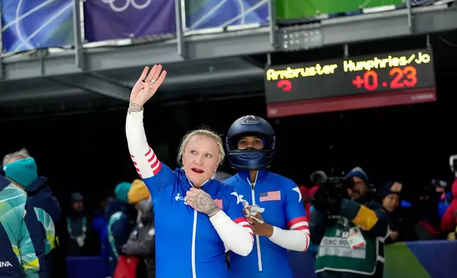 United States' Kaillie Armbruster Humphries, left, and Jasmine Jones, right, arrive at the finish during a two women bobsled run at the 2026 Winter Olympics, in Cortina d'Ampezzo, Italy, Friday, Feb. 20, 2026. (AP Photo/Alessandra Tarantino)