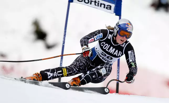 FILE - Lindsey Vonn, of the United States, speeds down the the 2.340-kilometer (1.45-mile) Olympia delle Tofane course on her way to take fifth place in a women's ski World Cup super-G event, in Cortina d'Ampezzo, Italy, Sunday, Jan. 20, 2008. (AP Photo/Marco Trovati, File)