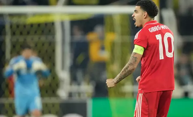 Nottingham Forest's Morgan Gibbs-White, celebrates scoring his side's third goal during a Europa league play-off first leg soccer match between Fenerbahce and Nottingham Forest in Istanbul, Turkey, Thursday, Feb. 19, 2026. (AP Photo/Emrah Gurel)