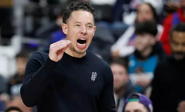 San Antonio Spurs head coach Mitch Johnson shouts to his team during the second half of an NBA basketball game against the Detroit Pistons, Monday, Feb. 23, 2026, in Detroit. (AP Photo/Duane Burleson)